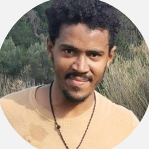 Portrait of Abel, East Africa — olive wood artisan on Lesvos