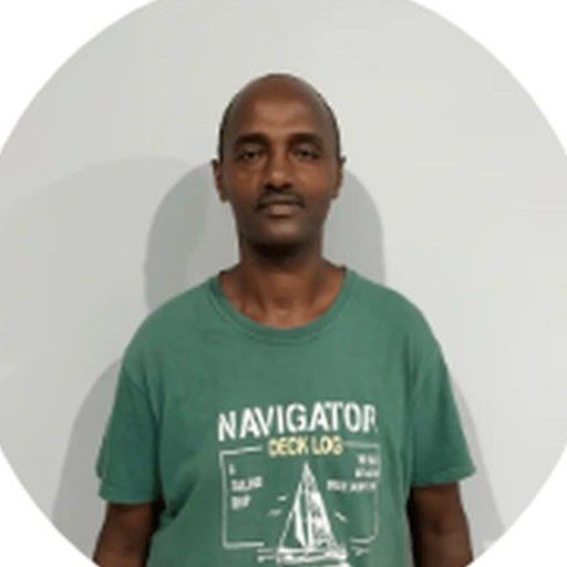 Portrait of Mobadek, East Africa — olive wood artisan on Lesvos